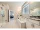 Elegant bathroom with granite counters, double sinks, and a large soaking tub at 9880 E 160Th Pl, Brighton, CO 80602