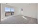 Bedroom with a sliding glass door leading to a private balcony and scenic views at 8858 Waterleaf Ln, Littleton, CO 80125