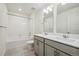 Bathroom featuring double sinks, modern fixtures, and a shower and tub combination at 1638 Plata St, Lochbuie, CO 80603