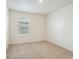 This bedroom has neutral carpeting, a window, and light colored walls at 1638 Plata St, Lochbuie, CO 80603