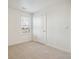 This bedroom has neutral carpeting, a window, and light colored walls at 1638 Plata St, Lochbuie, CO 80603
