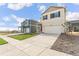 Beautiful two-story home with a spacious driveway, complemented by a neat lawn and landscaping at 1638 Plata St, Lochbuie, CO 80603
