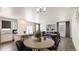 Bright, stylish living area with modern decor, a dining space, and lots of natural light at 1638 Plata St, Lochbuie, CO 80603