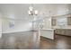 Spacious living room featuring hardwood floors, recessed lighting, and large windows for natural light at 1638 Plata St, Lochbuie, CO 80603