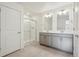 Main bathroom with double vanity, a glass shower, and modern finishes at 1638 Plata St, Lochbuie, CO 80603