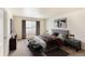Comfortable main bedroom featuring a king-size bed, modern furniture, and neutral tones at 1638 Plata St, Lochbuie, CO 80603