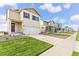A street view featuring a line of attractive two-story homes with well-kept lawns and driveways at 1638 Plata St, Lochbuie, CO 80603