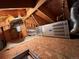 Attic space with exposed rafters and a Carrier heating system, offering potential for storage or conversion at 1843 S Urban Way, Lakewood, CO 80228