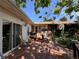 View of the wooden back deck featuring outdoor seating and partially shaded by the surrounding trees and foliage at 1843 S Urban Way, Lakewood, CO 80228