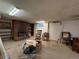 Unfinished basement with brick fireplace and ample space for customization and storage at 1843 S Urban Way, Lakewood, CO 80228