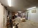 Unfinished basement area with wood paneling, drop ceiling and miscellaneous items, ready for your creative redesign at 1843 S Urban Way, Lakewood, CO 80228