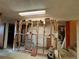 Unfinished basement with exposed framing, offering a blank canvas for customization and renovation at 1843 S Urban Way, Lakewood, CO 80228