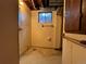 Small basement bathroom featuring a tiled shower and vintage fixtures needing remodeling or updating at 1843 S Urban Way, Lakewood, CO 80228