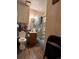 The bathroom features a toilet, a sink with vanity, and a shower with glass doors at 1843 S Urban Way, Lakewood, CO 80228