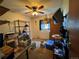 This bedroom features a ceiling fan, a tv, a window, and carpeted floors at 1843 S Urban Way, Lakewood, CO 80228