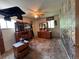 Spacious bedroom boasts multiple dressers, a ceiling fan, and charming forest-themed wallpaper at 1843 S Urban Way, Lakewood, CO 80228