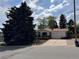 Nice single story home with a mature tree in the front yard with a big front yard at 1843 S Urban Way, Lakewood, CO 80228