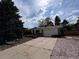 Charming single Gathering home with attached garage and long concrete driveway at 1843 S Urban Way, Lakewood, CO 80228