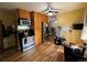 Spacious kitchen featuring stainless steel appliances, ample cabinets, and stylish vinyl flooring at 1843 S Urban Way, Lakewood, CO 80228