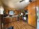 Functional kitchen featuring stainless steel appliances, ample cabinet space, and vinyl flooring at 1843 S Urban Way, Lakewood, CO 80228