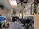 Bright sunroom with skylight, ceiling fan and a door to the backyard and potential workout area at 1843 S Urban Way, Lakewood, CO 80228