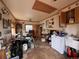 Combination utility/laundry room with tiled floor and a window offering potential for remodeling and organization at 1843 S Urban Way, Lakewood, CO 80228
