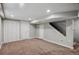Unfinished basement with carpeted floor, painted walls, and closet space at 1580 N Franklin St, Denver, CO 80218