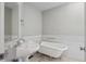 Charming bathroom with a classic clawfoot tub and pedestal sink at 1580 N Franklin St, Denver, CO 80218