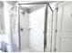 Modern bathroom features a clean shower with glass doors and white tiling at 1580 N Franklin St, Denver, CO 80218
