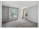Neutral bedroom with gray carpet and two windows providing natural light at 1580 N Franklin St, Denver, CO 80218