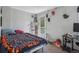 Comfortable bedroom with gray walls, carpet, a bed, and a balcony door at 1580 N Franklin St, Denver, CO 80218