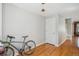 Spacious entryway featuring light gray walls, wooden floorboards, and staircase at 1580 N Franklin St, Denver, CO 80218