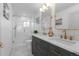 Modern bathroom with double vanity and gold fixtures at 2758 W 38Th Ave, Denver, CO 80211