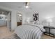 Spacious bedroom with a striped comforter and an ensuite bathroom at 2758 W 38Th Ave, Denver, CO 80211