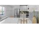 Modern kitchen with white cabinets, quartz countertops, and a gold faucet at 2758 W 38Th Ave, Denver, CO 80211