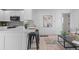 Modern kitchen with white cabinets and a large island with seating at 2758 W 38Th Ave, Denver, CO 80211