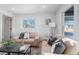 Light and airy living room with two neutral sofas and a coffee table at 2758 W 38Th Ave, Denver, CO 80211