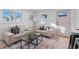 Bright living room featuring neutral colored couches and a coffee table at 2758 W 38Th Ave, Denver, CO 80211