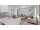 Bright living room with beige sofas and a large window at 2758 W 38Th Ave, Denver, CO 80211