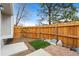 Backyard features a wooden fence, artificial turf, and a rock garden at 7999 Chase Cir # 31, Arvada, CO 80003