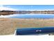 Scenic lake view with mountains in the distance seen from a comfortable park bench at 7999 Chase Cir # 31, Arvada, CO 80003