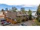 Aerial view of a well maintained three-story brick apartment building with parking at 70 N Grant St # 10, Denver, CO 80203