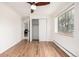 Bright bedroom featuring hardwood floors, a ceiling fan, a closet, and a window with natural light at 70 N Grant St # 10, Denver, CO 80203
