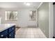 Bright, tiled dining space offering natural light and a view into the kitchen area at 70 N Grant St # 10, Denver, CO 80203