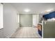 Tile floor dining room with natural light and easy access to the stylish, blue kitchen at 70 N Grant St # 10, Denver, CO 80203