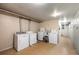 Functional laundry room featuring dual washer and dryer sets, along with a convenient utility sink at 70 N Grant St # 10, Denver, CO 80203