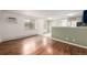 Bright living area with hardwood floors, large windows, and access to a modern kitchen at 70 N Grant St # 10, Denver, CO 80203