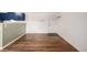 Hardwood floors leading to white walls and a front door, exuding warmth and potential at 70 N Grant St # 10, Denver, CO 80203