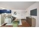 Cozy living room featuring modern decor, hardwood floors, and seamless kitchen access at 70 N Grant St # 10, Denver, CO 80203