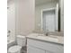 A bright bathroom features a vanity with a sink, toilet, and tiled shower/tub combo at 48270 Shetland Dr, Bennett, CO 80102